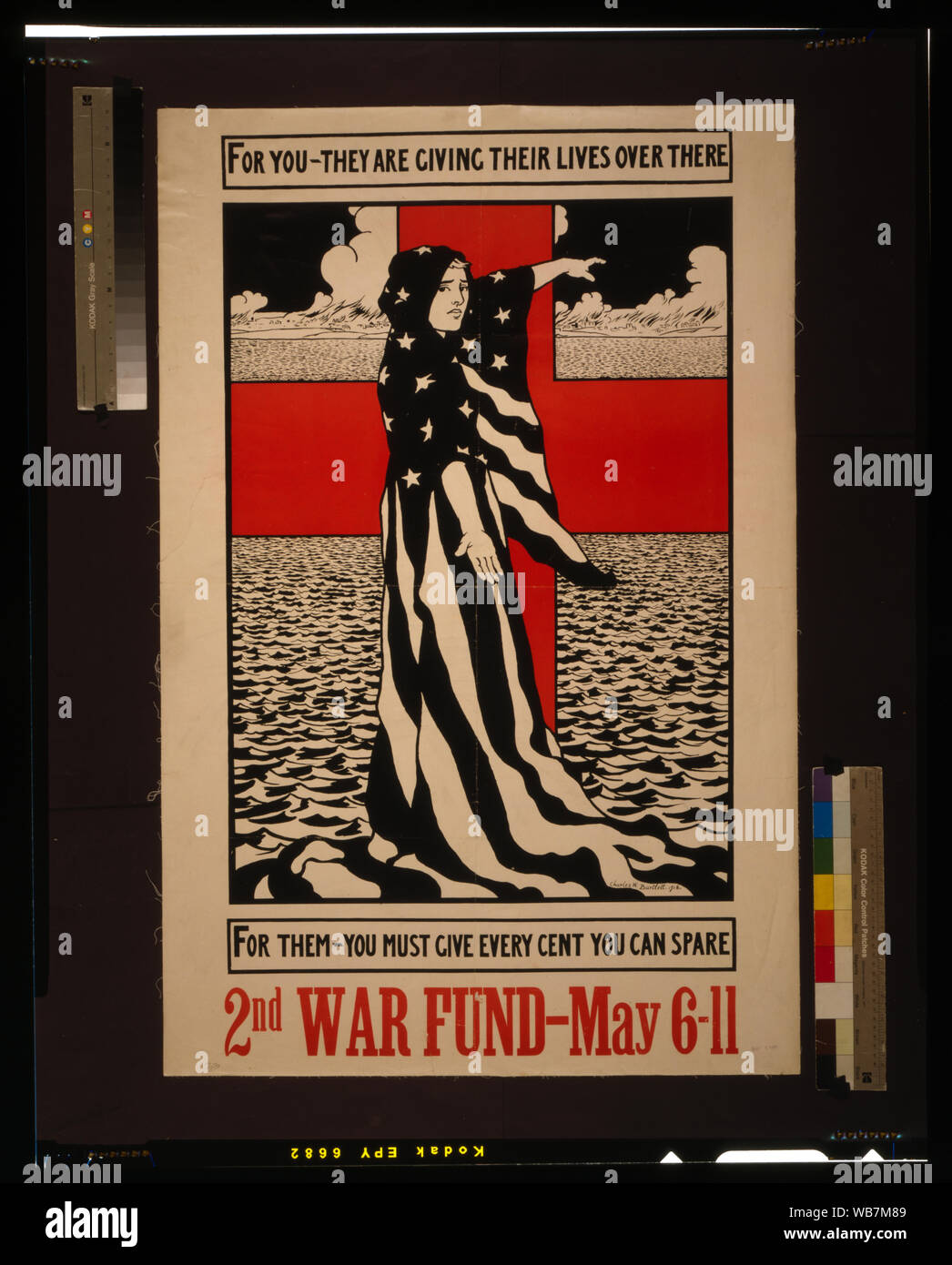 For you - they are giving their lives over there--For them - you must give every cent you can spare Abstract: Poster showing a woman draped in American flag, in front of red cross, pointing across ocean. Stock Photo