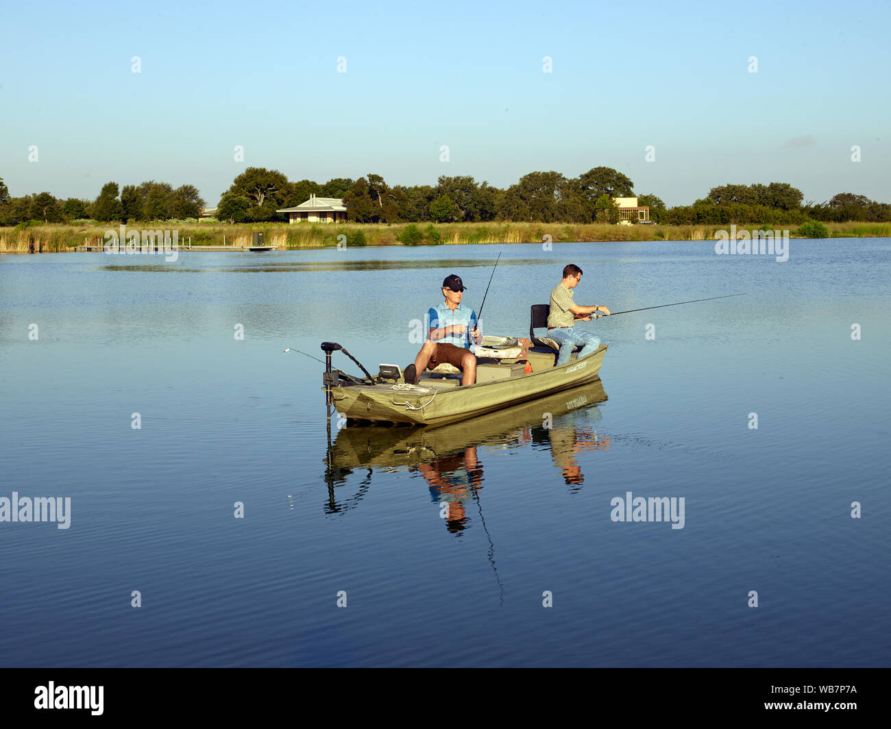 Former U.S. President George W. Bush and an aide fish at the 1,600-acre Crawford Ranch, owned by Mr. Bush and former first lady Laura Bush near Crawford in McLennon County, Texas Stock Photo