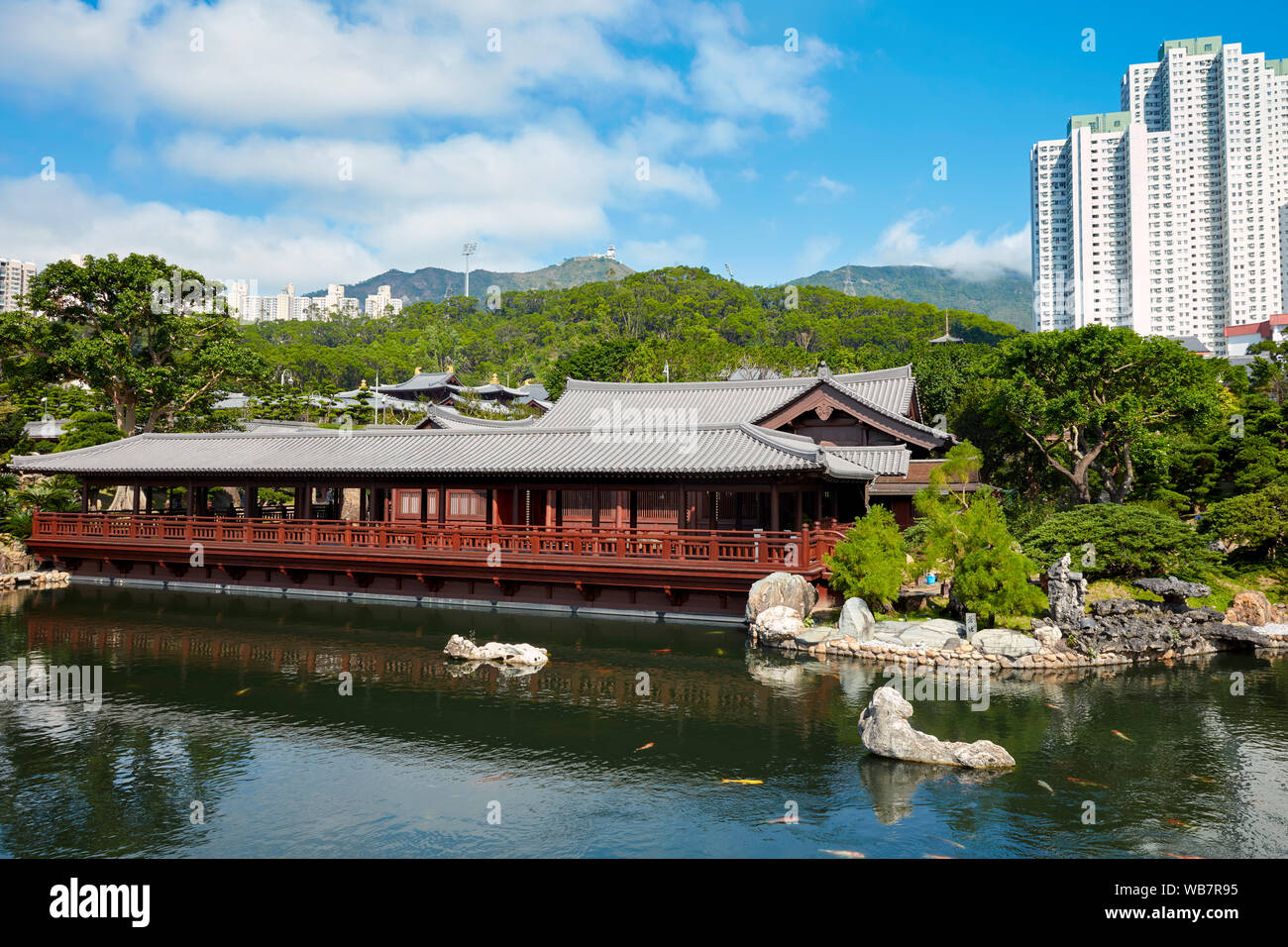 Traditional wooden pavilion at fish pond in Nan Lian Garden, a Chinese Classical Garden. Diamond Hill, Kowloon, Hong Kong, China. Stock Photo