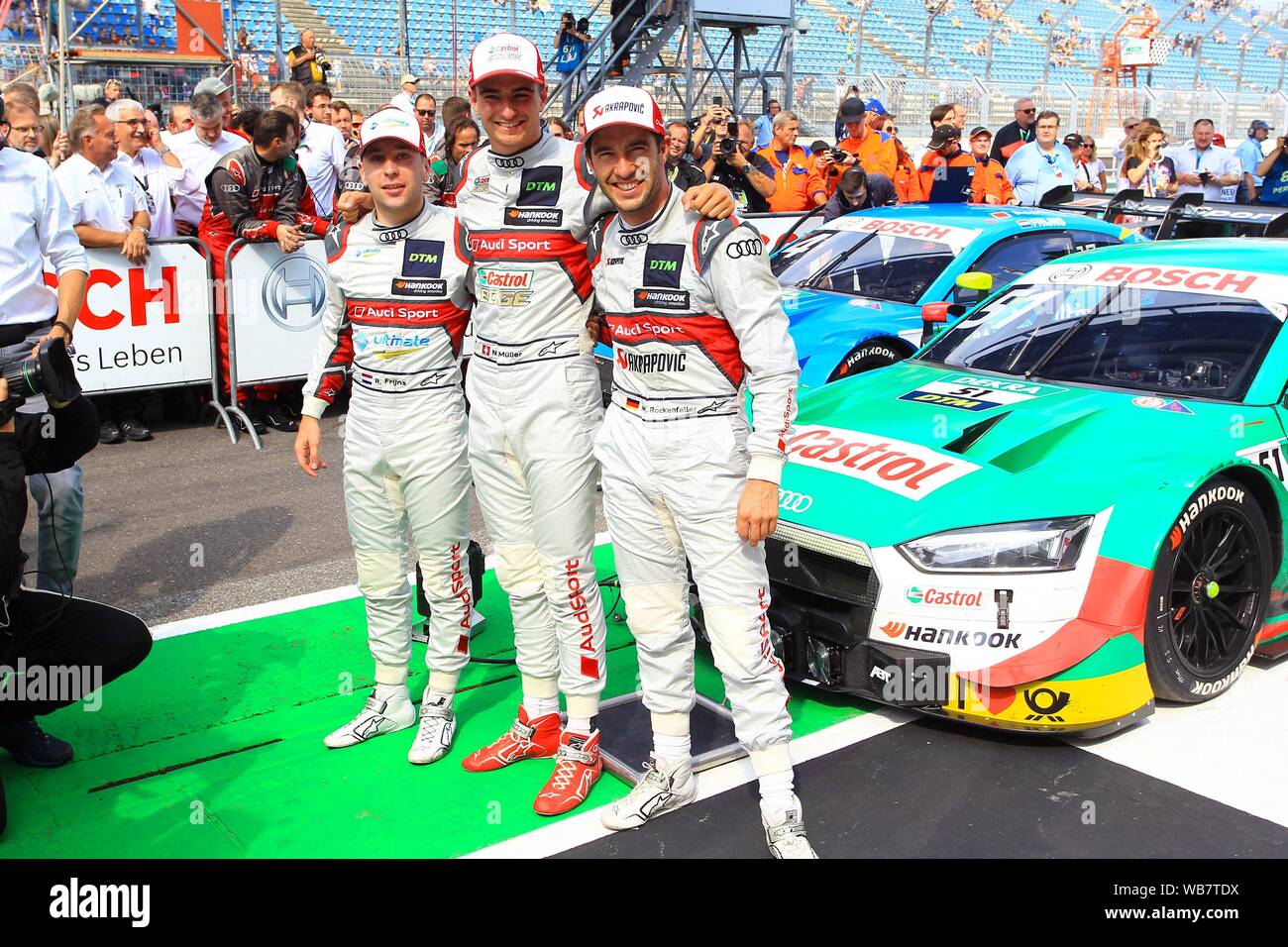 Klettwitz, Deutschland. 24th Aug, 2019. Klettwitz, Germany 23-25 August 2019: DTM Lausitzring - Race 1 - 2019 Group photo with Nico Mueller (Audi Sport Team Abt Sportsline # 51), Robin Frijns (Audi Sport Team Abt # 4) and Mike Rockenfeller (Audi Sport Team Phoenix # 99) | usage worldwide Credit: dpa/Alamy Live News Stock Photo