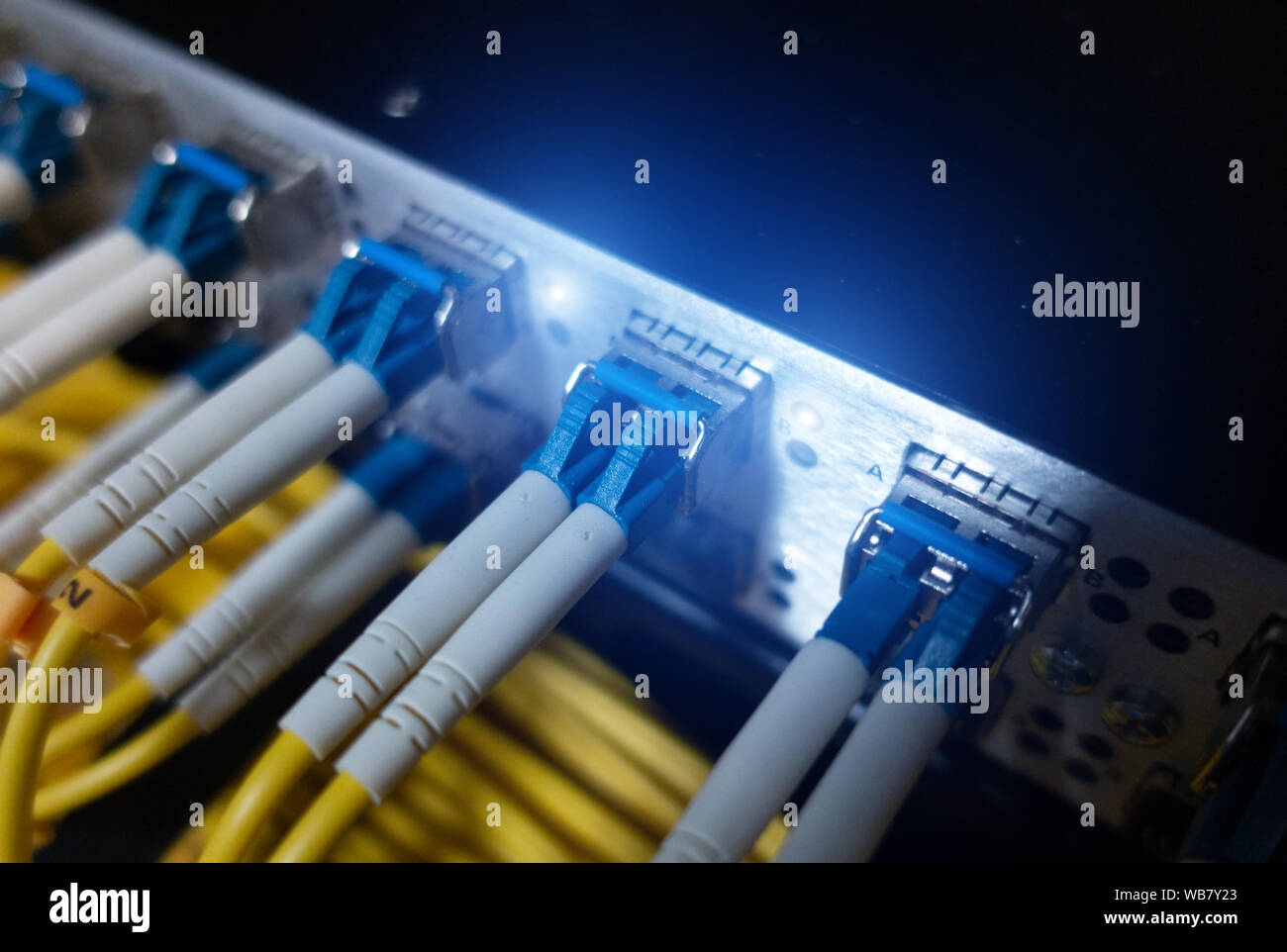optic fiber cables connected to data center Stock Photo