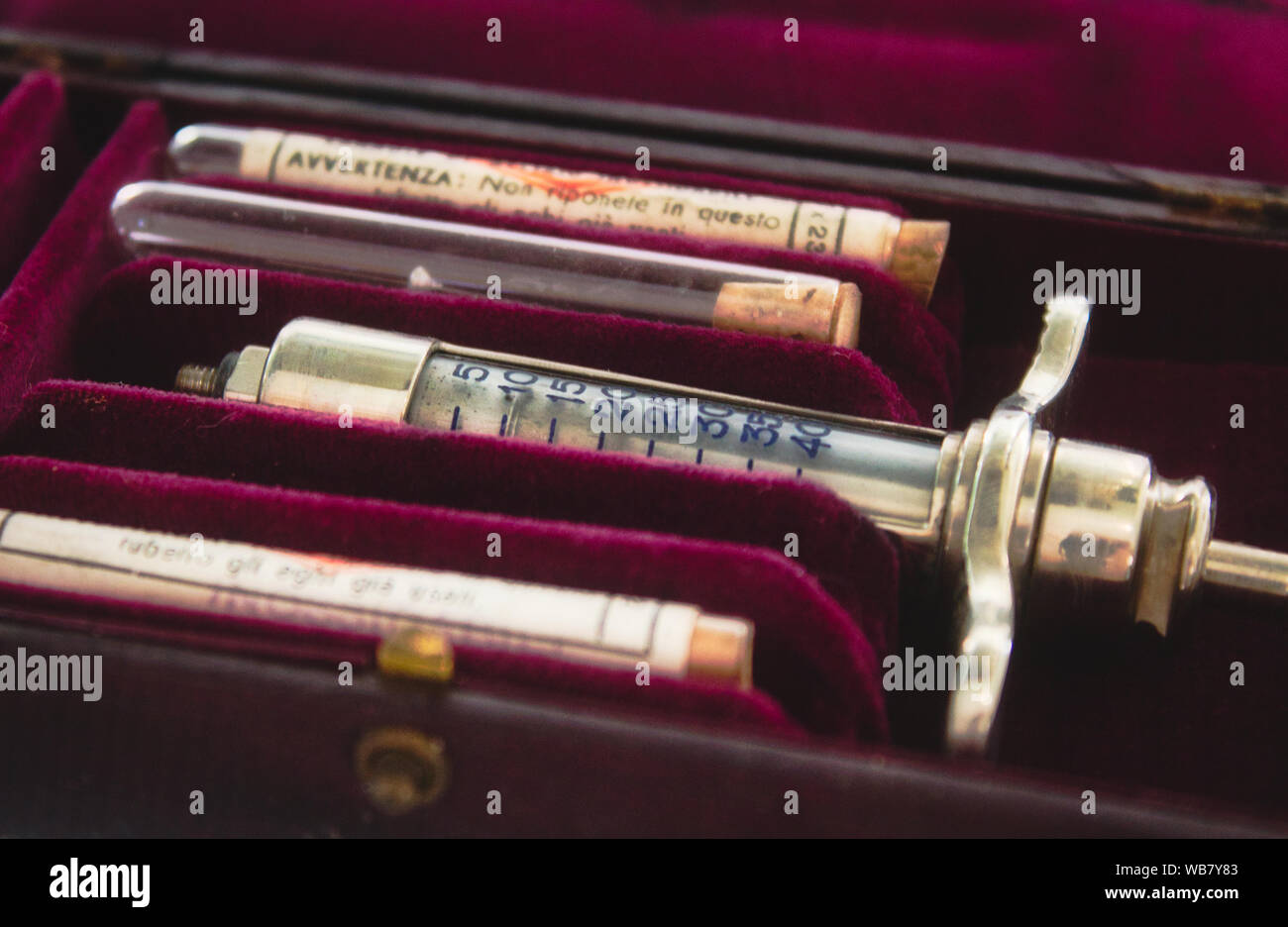 Old-fashioned syringe in a red case Stock Photo
