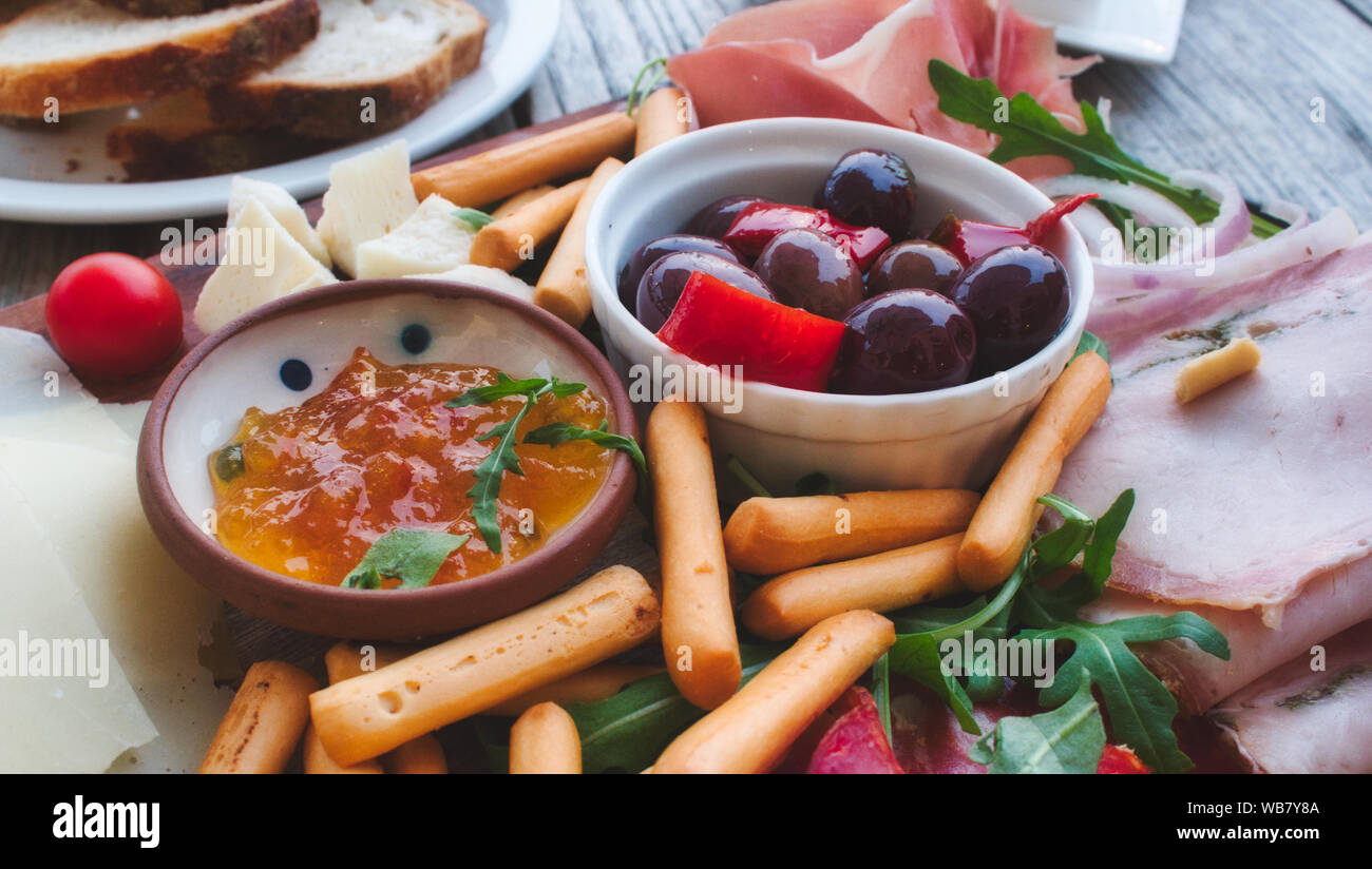 Close up of Mediterranean mixed platter to share with a selection of meats and cheeses Stock Photo