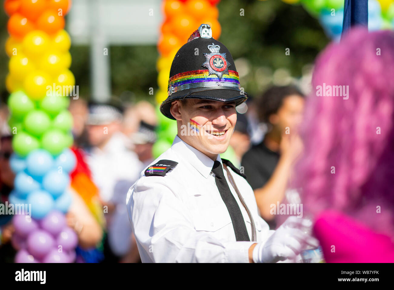 A policeman wearing rainbow colours during the Pride Cymru 2019 parade in Cardiff. Stock Photo