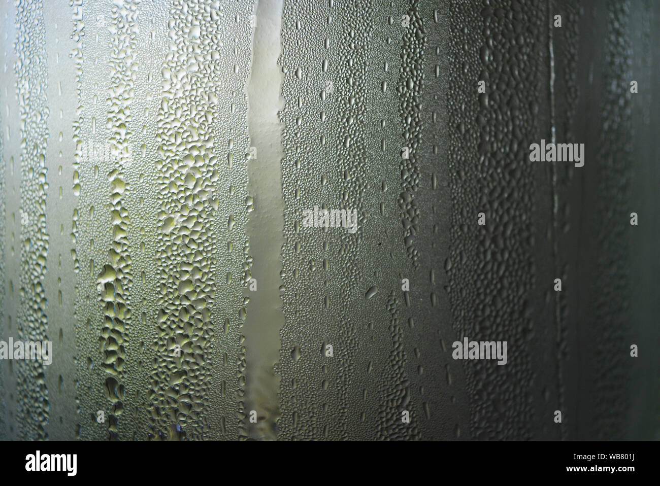 Transparent glass steamed with steam, condensation of water and small ...