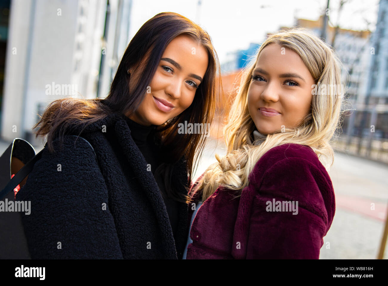 Close-up Portrait Of Cheerful and Beautiful Young Women Friends In City Stock Photo