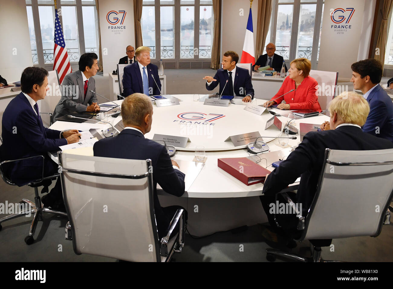 Canada's Prime Minister Justin Trudeau, Britain's Prime Minister Boris Johnson, Germany's Chancellor Angela Merkel, European Council President Donald Tusk, France's President Emmanuel Macron, Italy's Prime Minister Giuseppe Conte, Japan's Prime Minister Shinzo Abe and US President Donald Trump meet for the first working session of the G7 Summit in Biarritz, France. Stock Photo