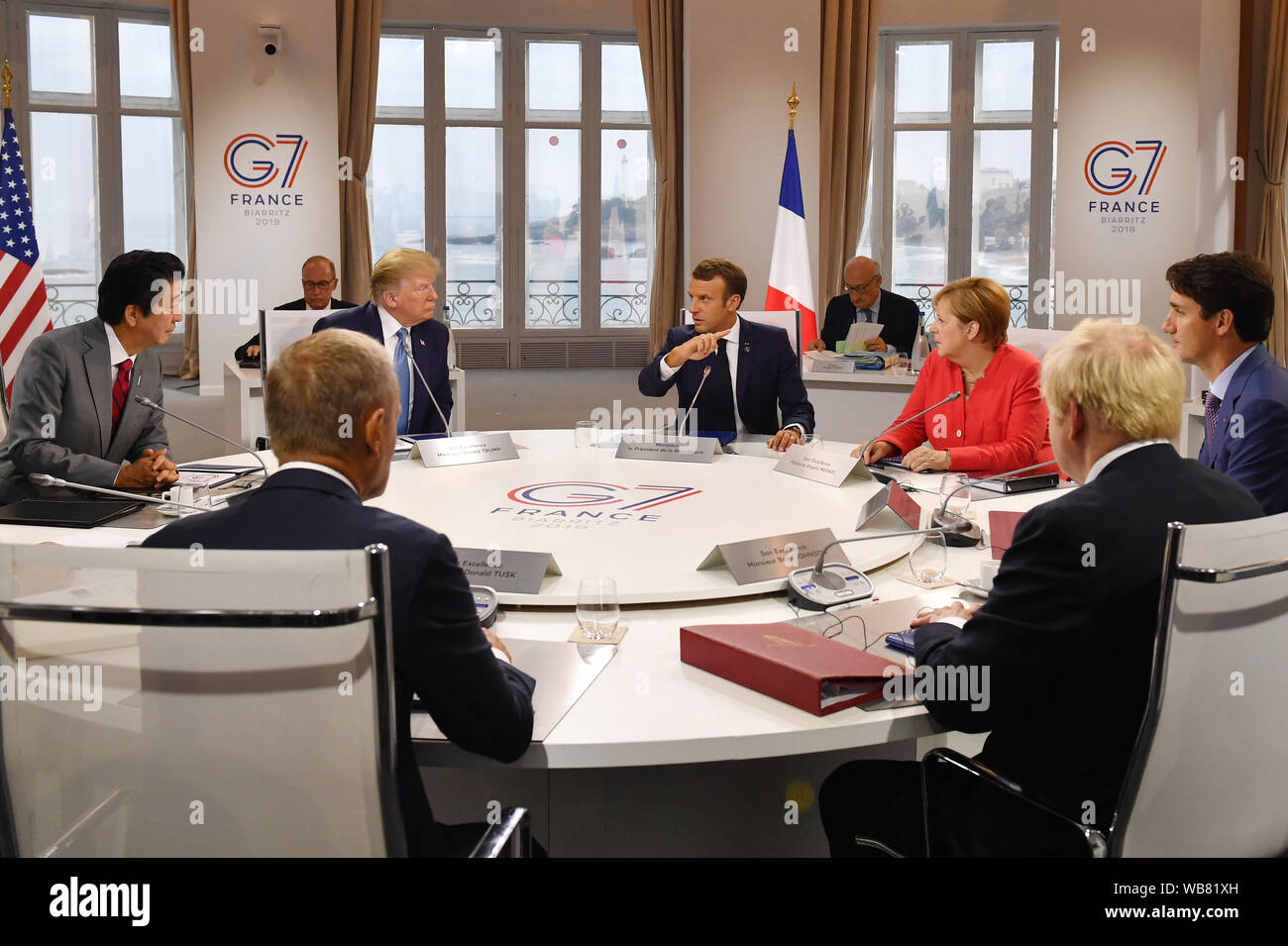 Canada's Prime Minister Justin Trudeau, Prime Minister Boris Johnson, Germany's Chancellor Angela Merkel, European Council President Donald Tusk, France's President Emmanuel Macron, Japan's Prime Minister Shinzo Abe and US President Donald Trump meet for the first working session of the G7 Summit in Biarritz, France. Stock Photo