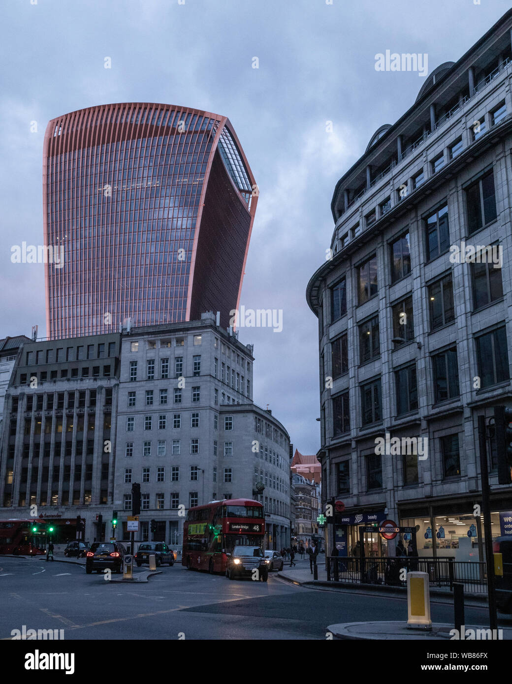 Red rays from sun in sky garden building Stock Photo