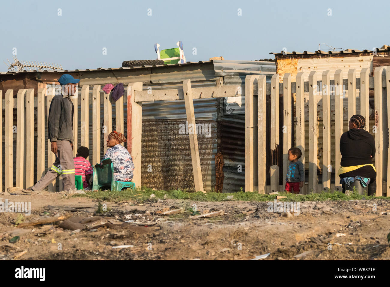 Black South African people in daily life in poverty and hardship in the impoverished township of Diepsloot outside Johannesburg, Gauteng, South Africa Stock Photo