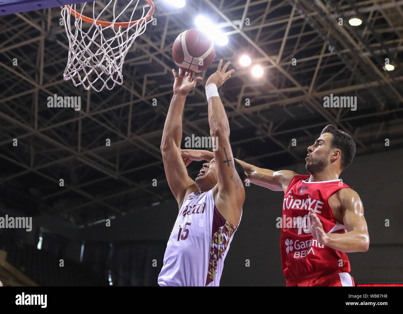 Suzhou, China's Jiangsu Province. 25th Aug, 2019. Venezuela's Windi Graterol (L) goes for a basket during a match against Turkey at the 2019 Suzhou International Basketball Challenge and Culture Week in Suzhou, east China's Jiangsu Province, Aug. 25, 2019. Credit: Yang Lei/Xinhua/Alamy Live News Stock Photo