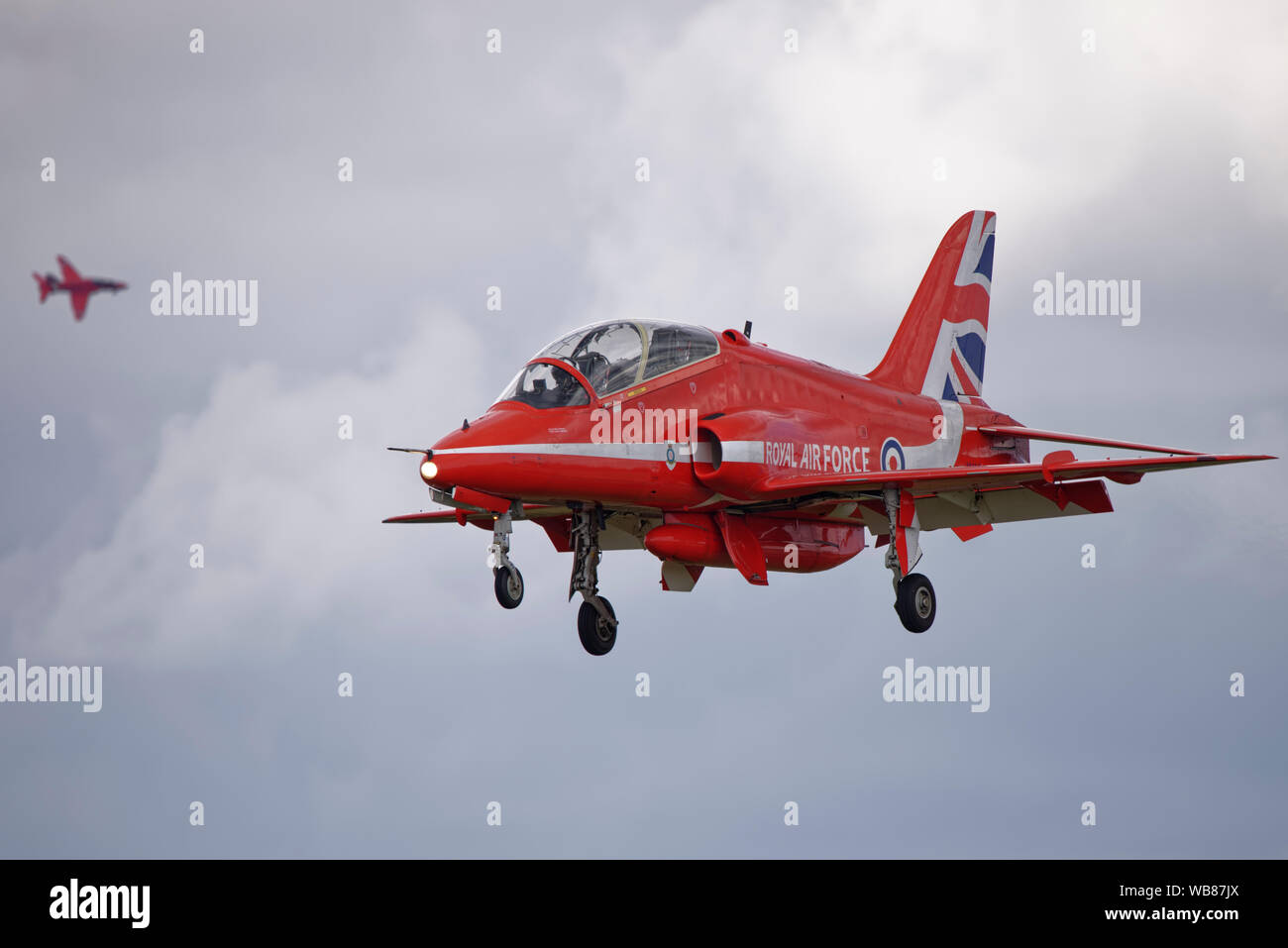 British Hawk military jet trainer XX244 of the Royal Air Force Red Arrows Aerobatic Display Team on finals to land at RAF Fairford Stock Photo