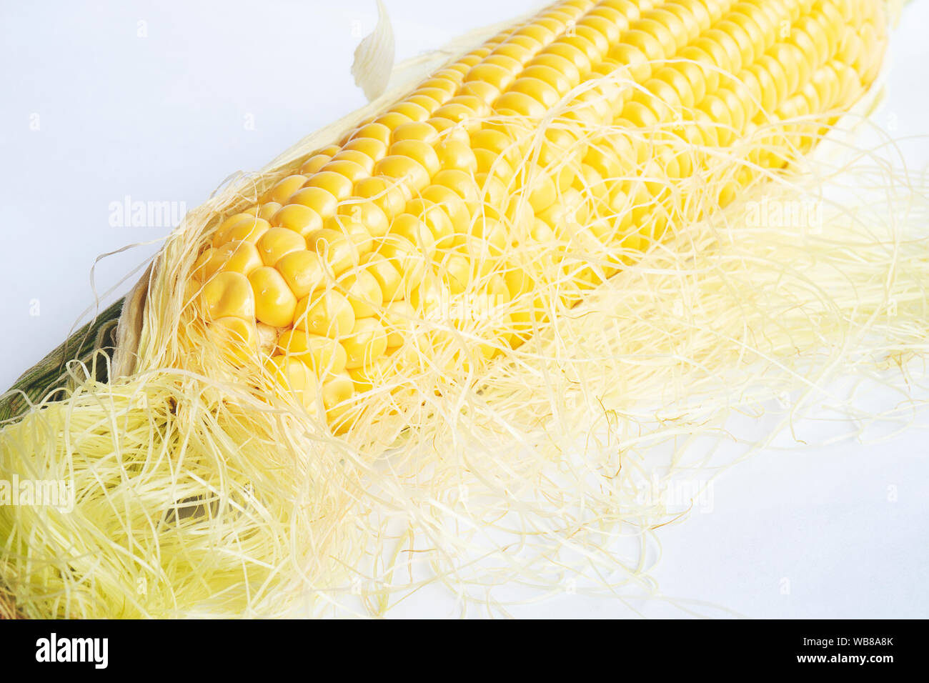 Single ear of corn isolated on white background as package design element Stock Photo