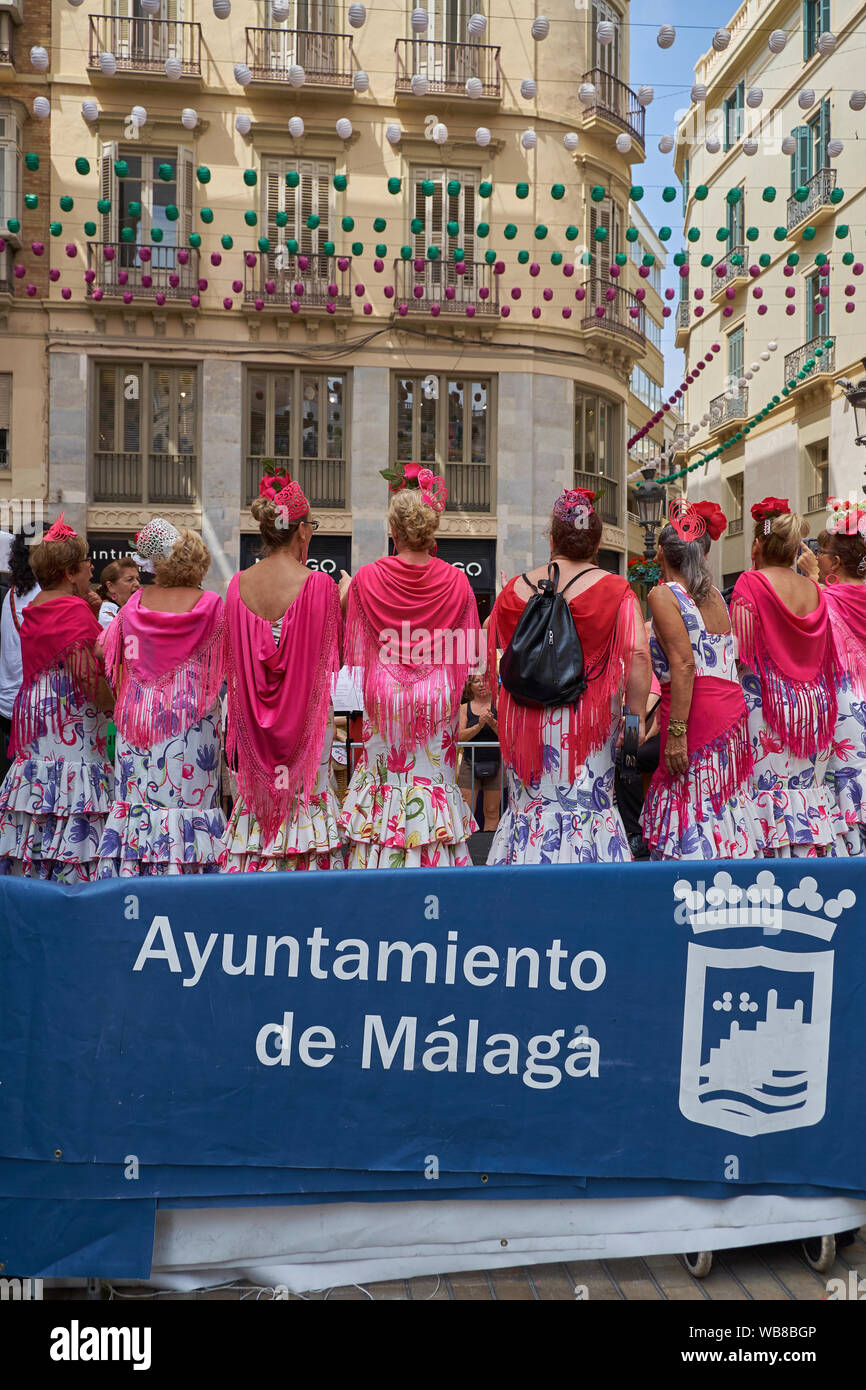 Women wearing typical flamenco dresses. Fair of Málaga 2019, Andalusia, Spain. Stock Photo