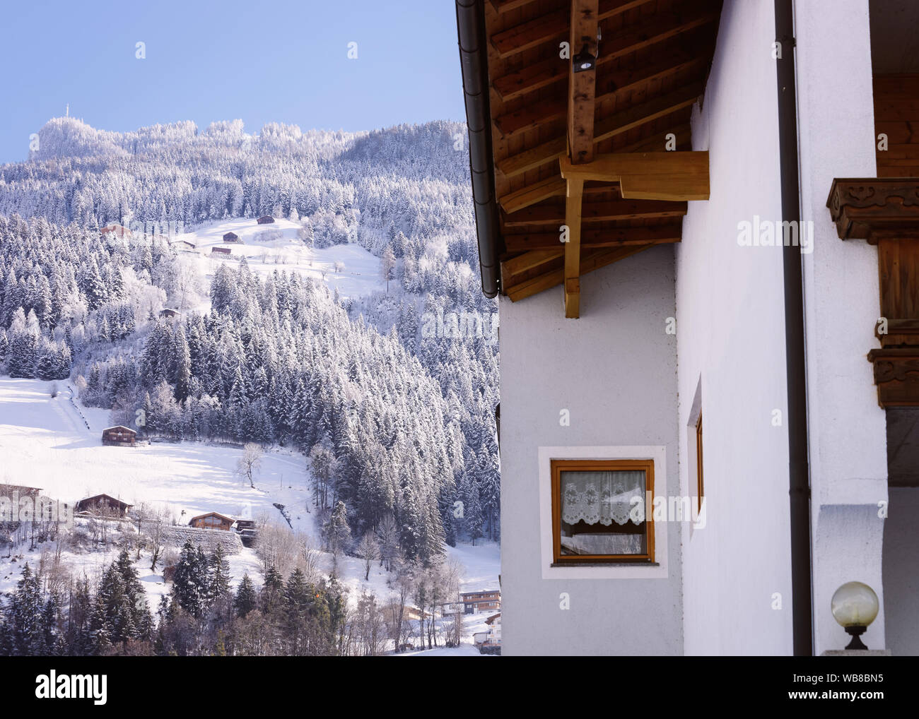 House architecture in snow winter landscape at Mayrhofen in Zillertal valley in Alps in Tirol in Austria. Townhouse real estate and residential buildi Stock Photo