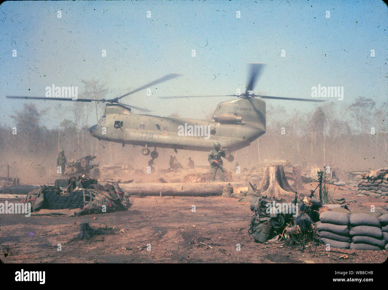 A US Army Chinook helicopter lifts off from a forward military base during the Vietnam War in 1966. Stock Photo