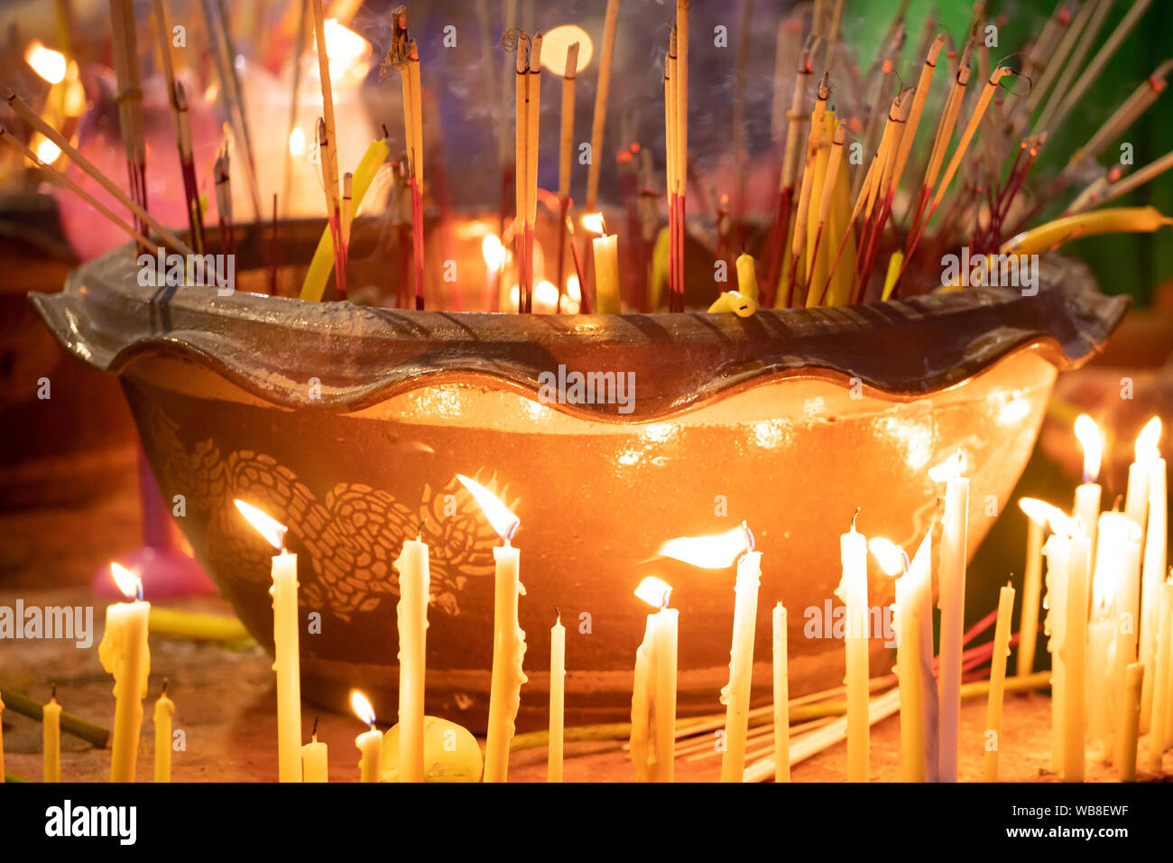Burning incense and candles at thai buddhis celebration Visakha Bucha