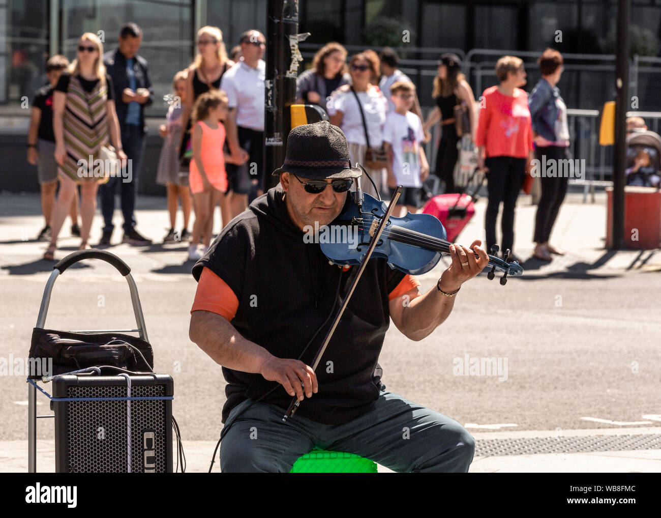 Musician at London street playing violin Stock Photo