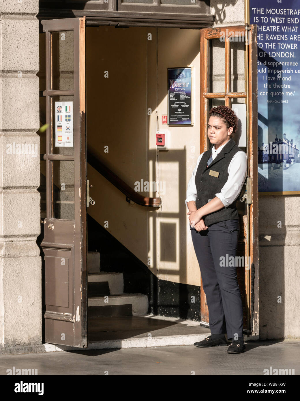 Lady doorman in London. Stock Photo