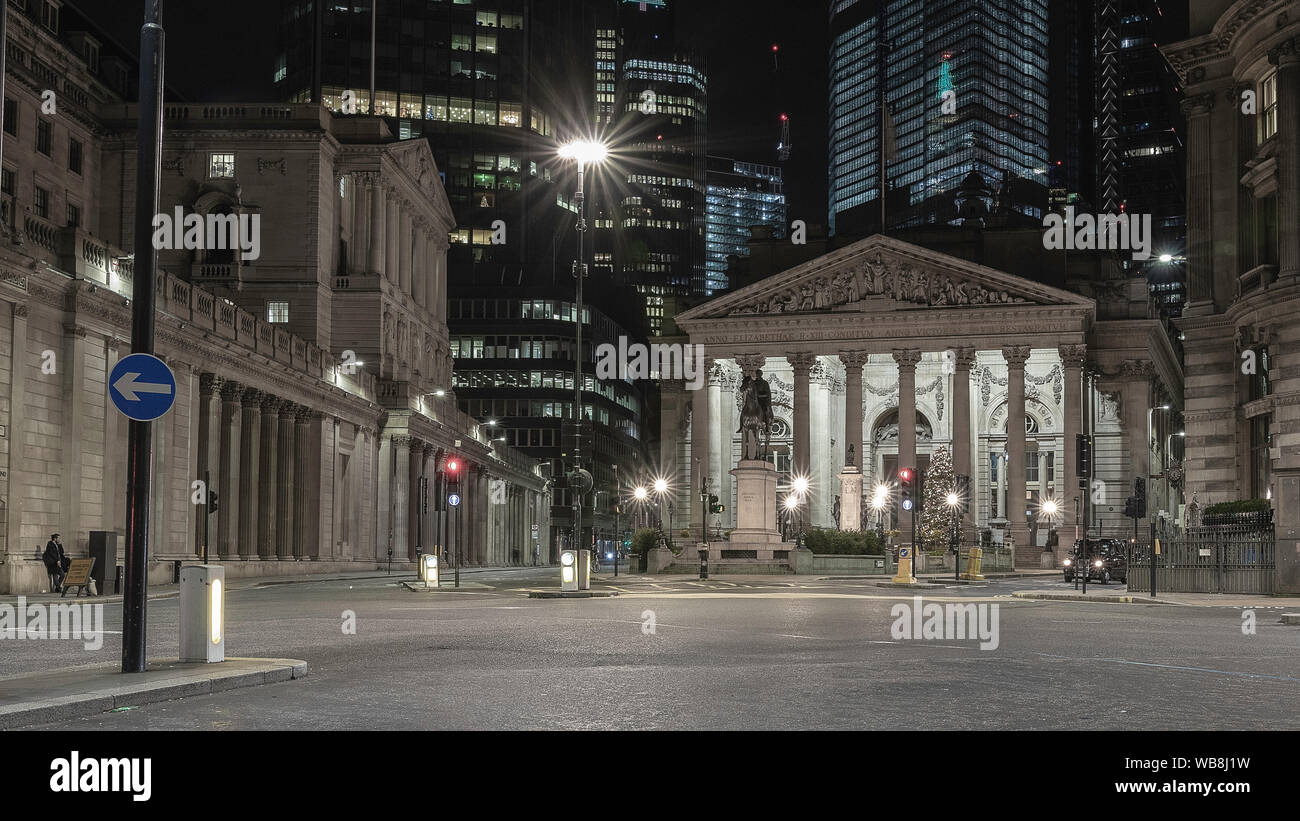 London streets at night near Bank of England building with passing transport Stock Photo