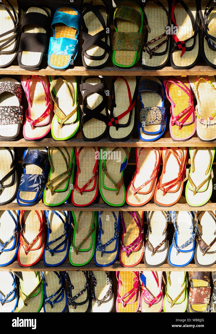 Traditional Havaianas Vietnamese flip-flops shoes on dispay at street market in Hoi An old city in Southeast Asia in Vietnam. Handmade sandals souveni Stock Photo