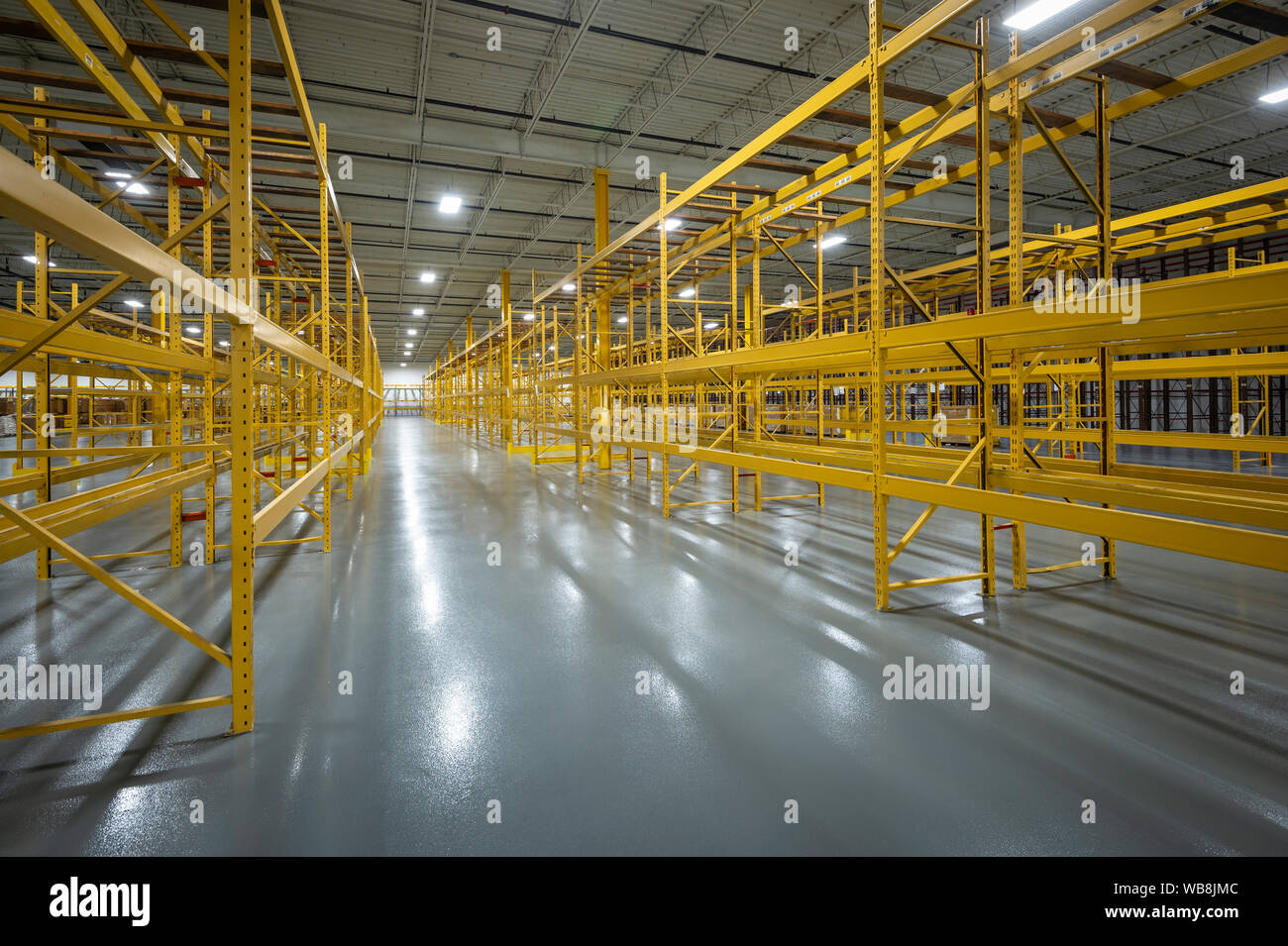 Empty Shelves In Empty Warehouse Stock Photo