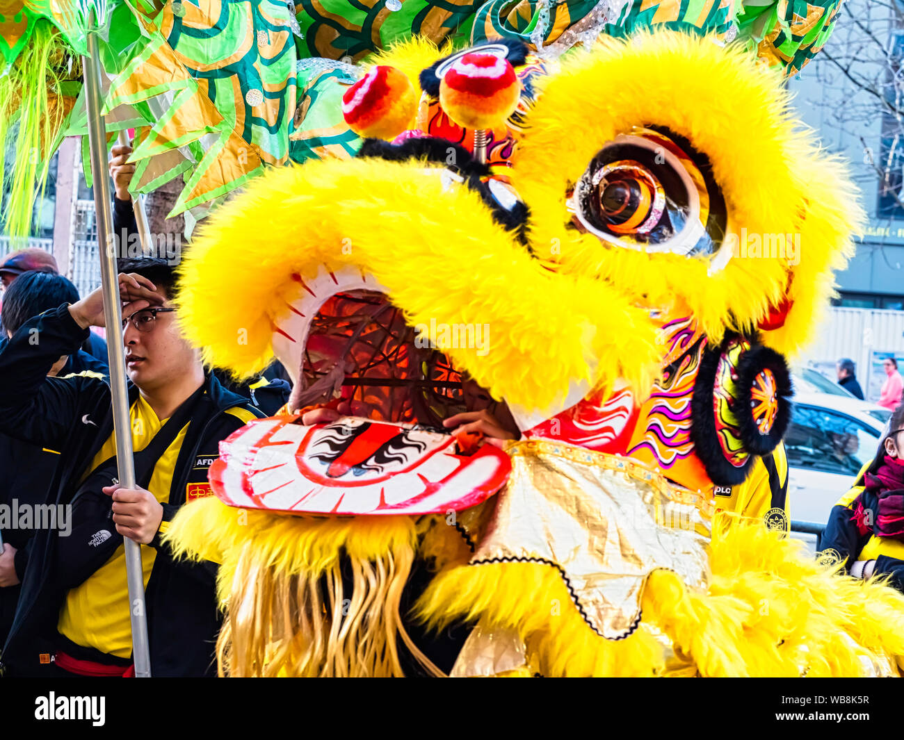 PARIS, FRANCE - FEBRUARY 17, 2019. Last day of the chinese new year celebration festival in street. Dance of colorful lions decoration masks in the st Stock Photo
