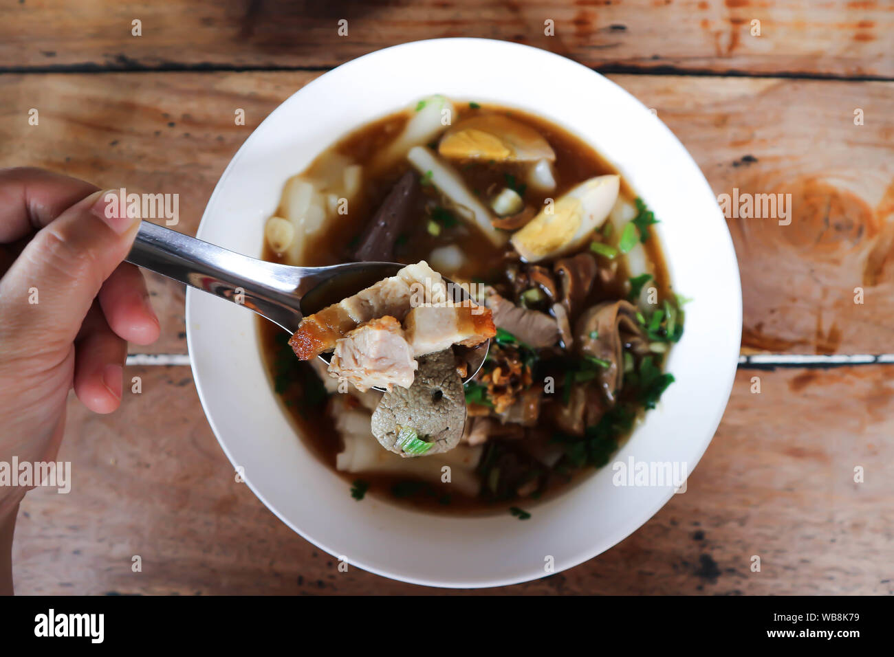 eating noodle, Chinese noodle or pork and egg noodle Stock Photo