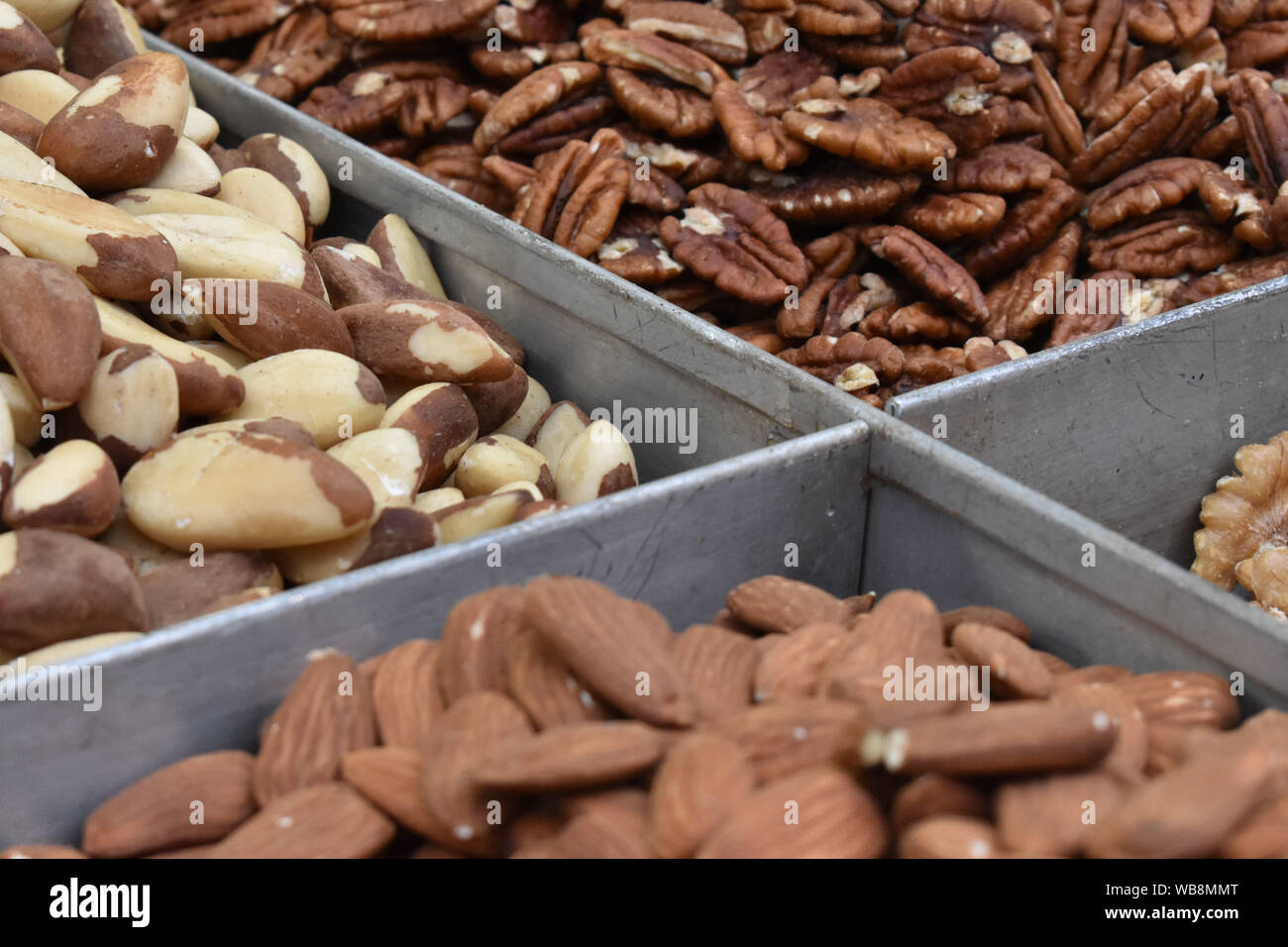 Four types of nuts in bulk Stock Photo Alamy