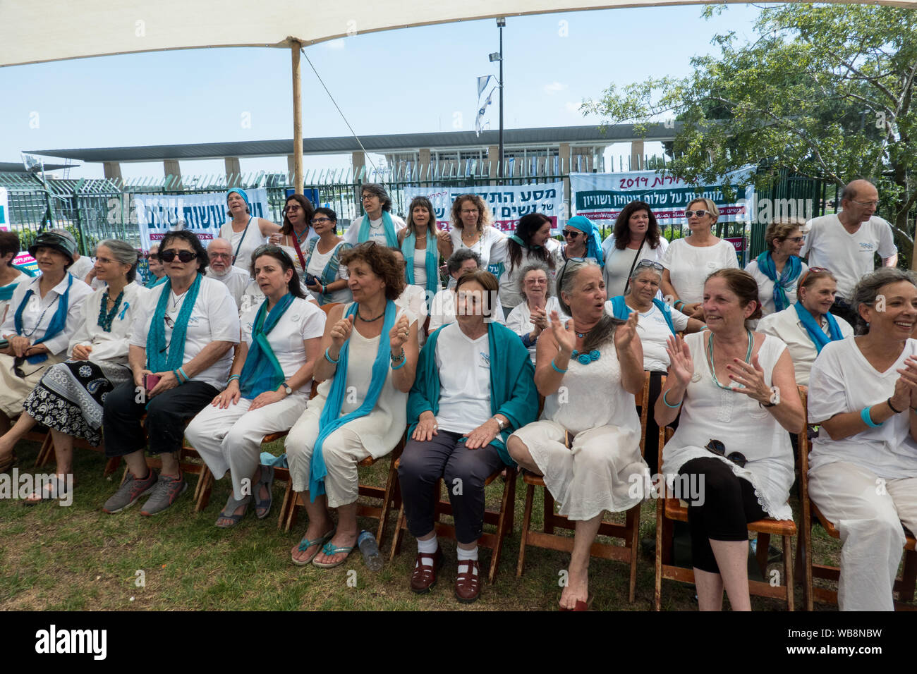 Jerusalem, Israel. 25th August, 2019. Women Wage Peace kick start their 4 day 'Journey of Hope' with an event at the Wohl Rose Garden opposite the Knesset ahead of the second round of 2019 national elections scheduled for 19th September, 2019. Assembling from all over the country, both Jewish and Arab women, they voice their demand from government for a political agreement with the country's adversaries and urge everyone to vote without concessions on equality, security and peace. Credit: Nir Alon/Alamy Live News. Stock Photo