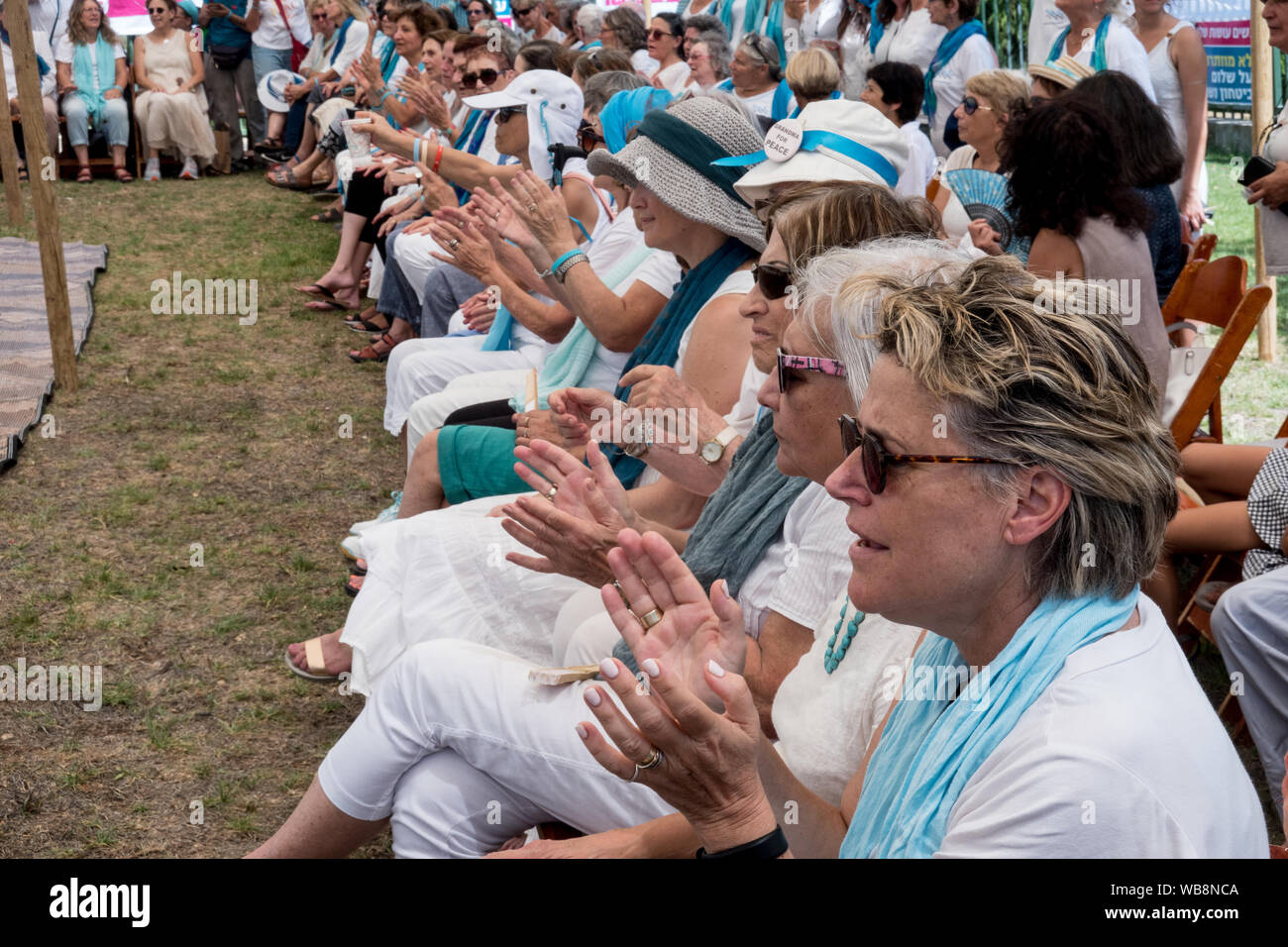 Jerusalem, Israel. 25th August, 2019. Women Wage Peace kick start their 4 day 'Journey of Hope' with an event at the Wohl Rose Garden opposite the Knesset ahead of the second round of 2019 national elections scheduled for 19th September, 2019. Assembling from all over the country, both Jewish and Arab women, they voice their demand from government for a political agreement with the country's adversaries and urge everyone to vote without concessions on equality, security and peace. Credit: Nir Alon/Alamy Live News. Stock Photo