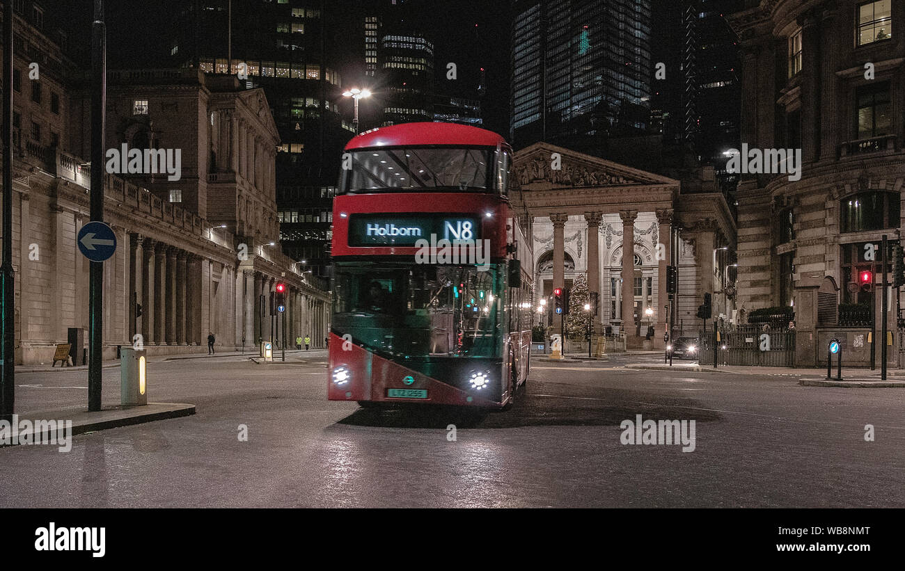 London streets at night near Bank of England building with passing transport Stock Photo