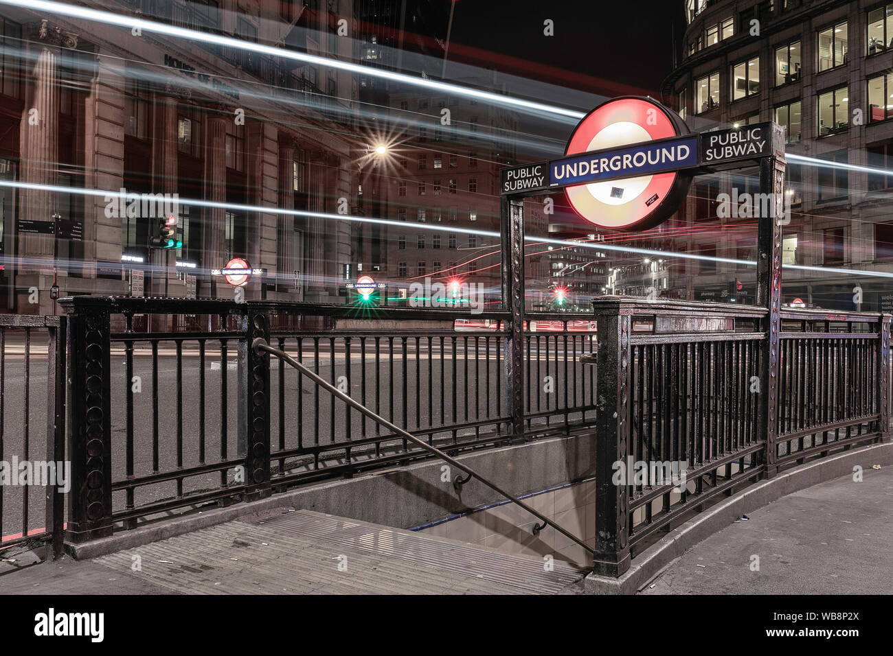 Underground signs in London streets at night Stock Photo