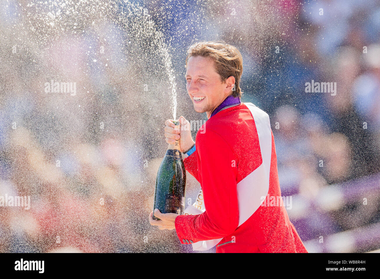 Rotterdam, Netherlands. 25th Aug, 2019. European Championships, equestrian sport, jumping, finals, singles: The Swiss rider Martin Fuchs is delighted about the gold medal. Credit: Rolf Vennenbernd/dpa/Alamy Live News Stock Photo