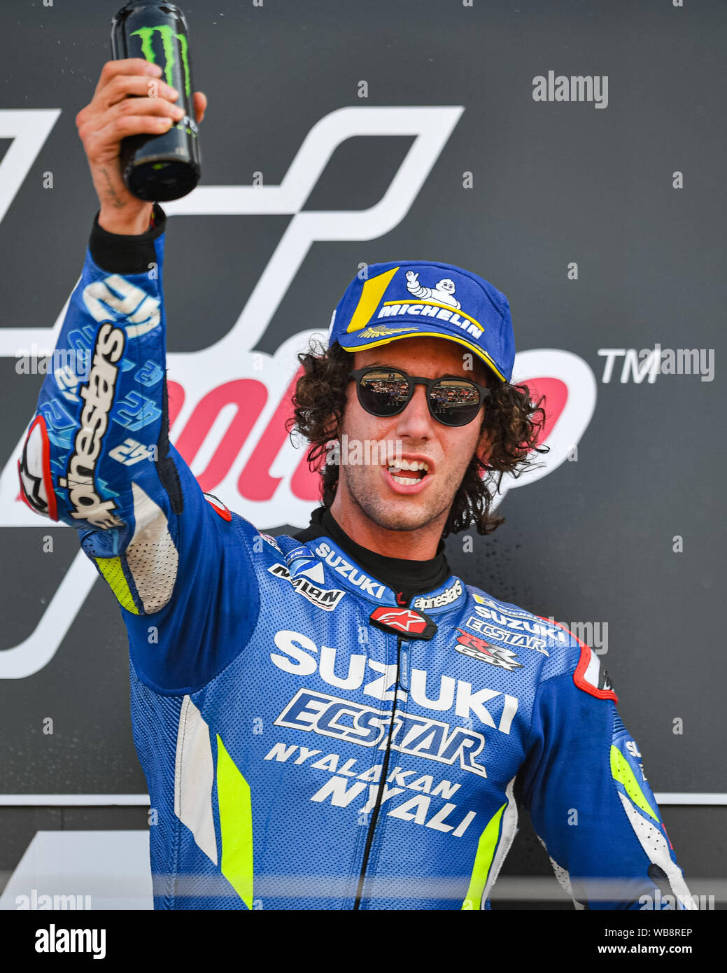 Towcester, UK. 25th Aug, 2019. Alex Rins (SPA) of Team SUZUKI ECSTAR celebrates winning the Sunday Race at presentation after the Sunday’s Race of  GoPro British Grand Prix at Silverstone Circuit on Sunday, August 25, 2019 in TOWCESTER, ENGLAND. Credit: Taka G Wu/Alamy Live News Stock Photo