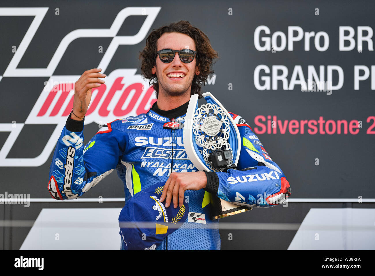 Towcester, UK. 25th Aug, 2019. Alex Rins (SPA) of Team SUZUKI ECSTAR celebrates winning the Sunday Race at presentation after the Sunday’s Race of  GoPro British Grand Prix at Silverstone Circuit on Sunday, August 25, 2019 in TOWCESTER, ENGLAND. Credit: Taka G Wu/Alamy Live News Stock Photo