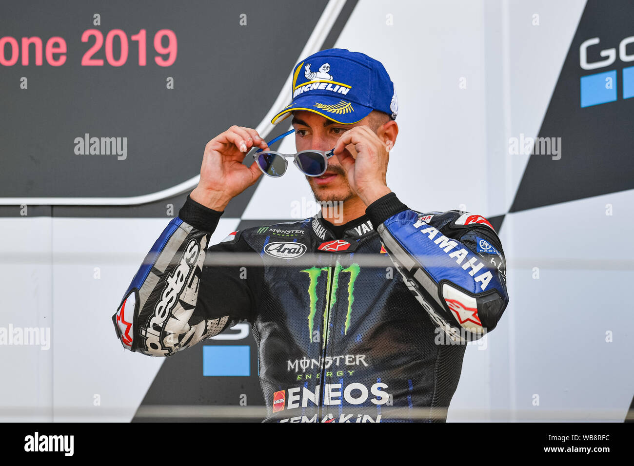 Towcester, UK. 25th Aug, 2019.  Maverick Vinales (SPA) of Monster Energy Yamaha MotoGP (3rd place) at winner’s presentation after the Sunday’s Race of  GoPro British Grand Prix at Silverstone Circuit on Sunday, August 25, 2019 in TOWCESTER, ENGLAND. Credit: Taka G Wu/Alamy Live News Stock Photo