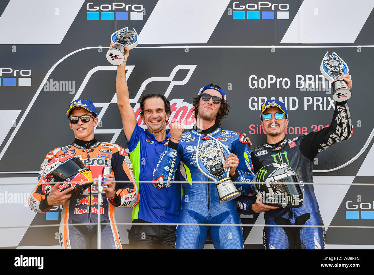 Towcester, UK. 25th Aug, 2019. The winner Alex Rins (SPA) of Team SUZUKI ECSTAR (centre), second place Marc Marquez (SPA) of Repsol Honda Team (left) and Maverick Vinales (SPA) of Monster Energy Yamaha MotoGP (3rd place, right) winner’s presentation after the Sunday’s Race of  GoPro British Grand Prix at Silverstone Circuit on Sunday, August 25, 2019 in TOWCESTER, ENGLAND. Credit: Taka G Wu/Alamy Live News Stock Photo