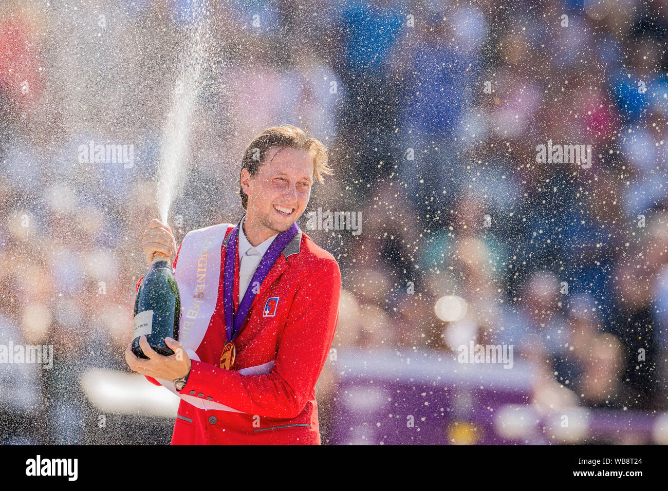 Rotterdam, Netherlands. 25th Aug, 2019. European Championships, equestrian sport, jumping, finals, singles: The Swiss rider Martin Fuchs is delighted about the gold medal. Credit: Rolf Vennenbernd/dpa/Alamy Live News Stock Photo