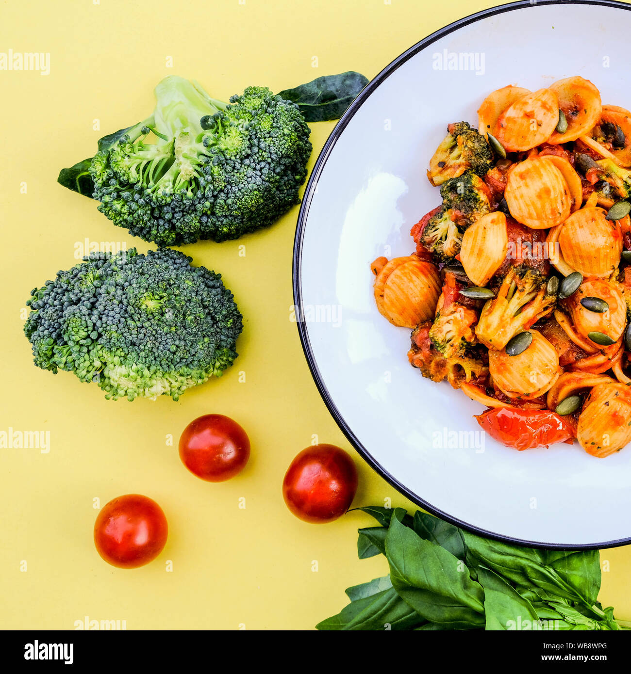 Italian Style Broccoli Orecchiette Pasta Vegetarian Meal With Sundried Tomatoes and Black Olives Stock Photo