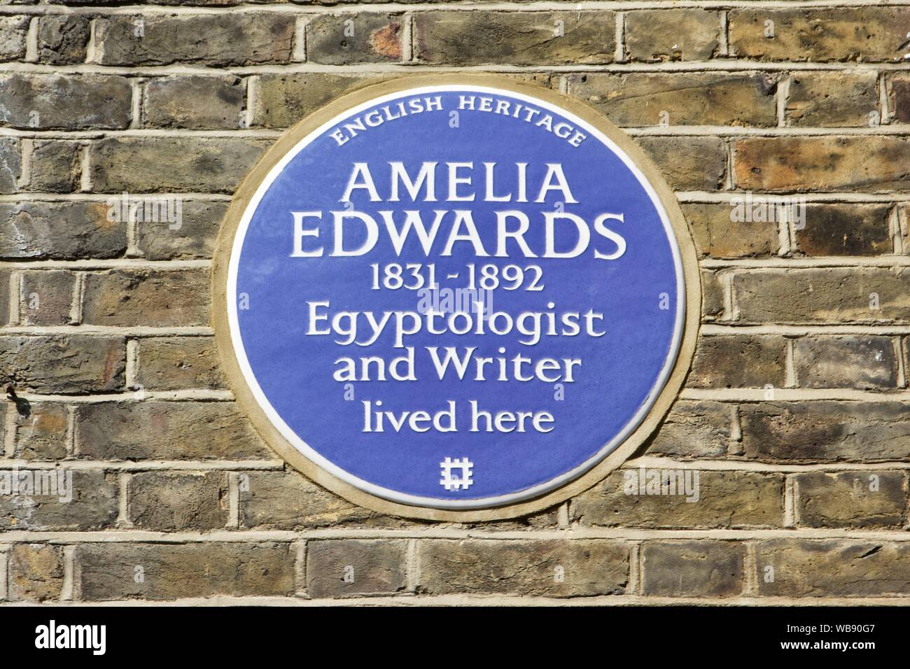 An English heritage blue plaque at 19 Wharton Street in London, for Amelia Edwards who was an Egyptologist Stock Photo