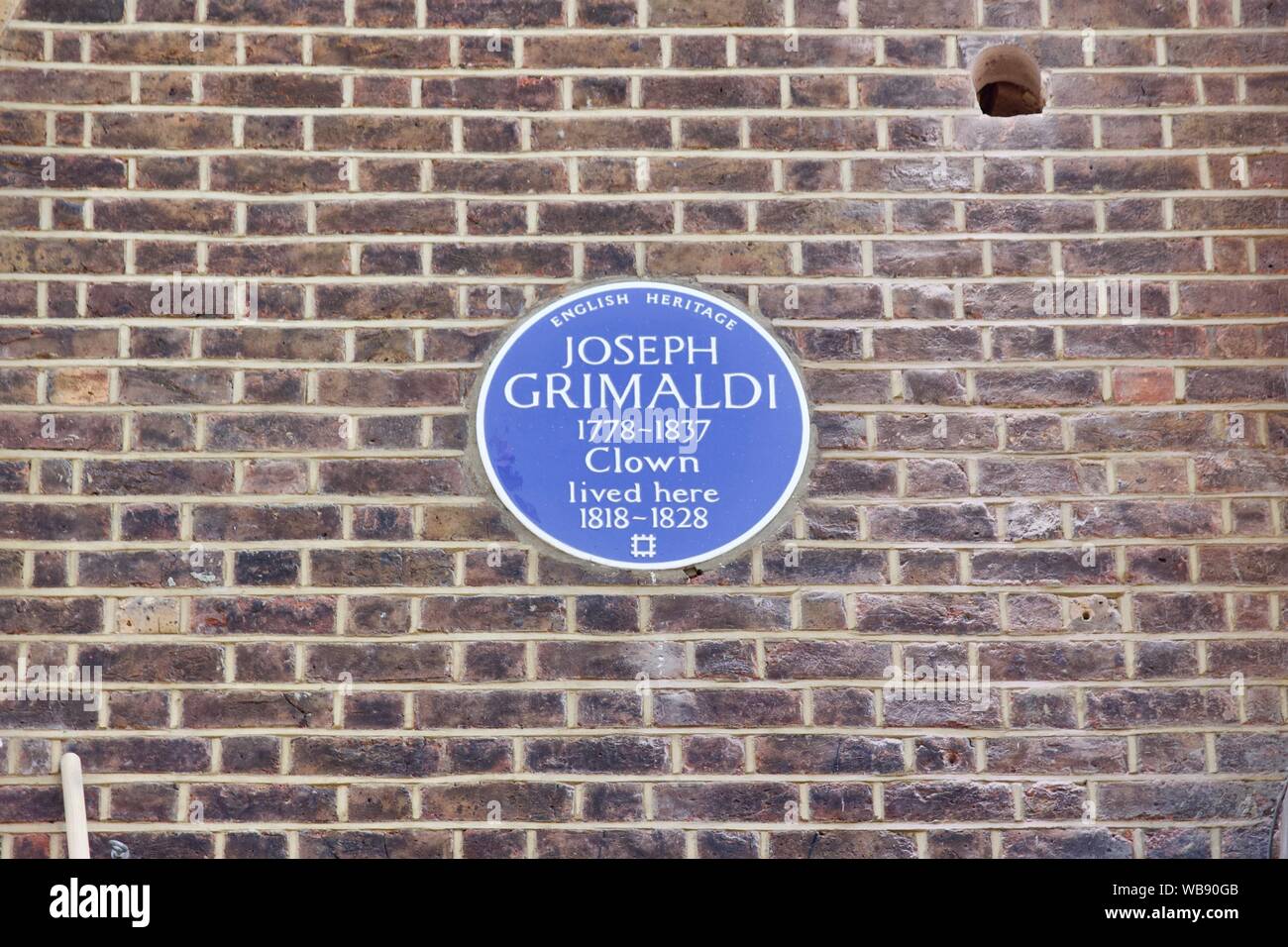 An English Heritage blue plaque at 56 Exmouth Market, London for Joseph Grimaldi who was a clown Stock Photo