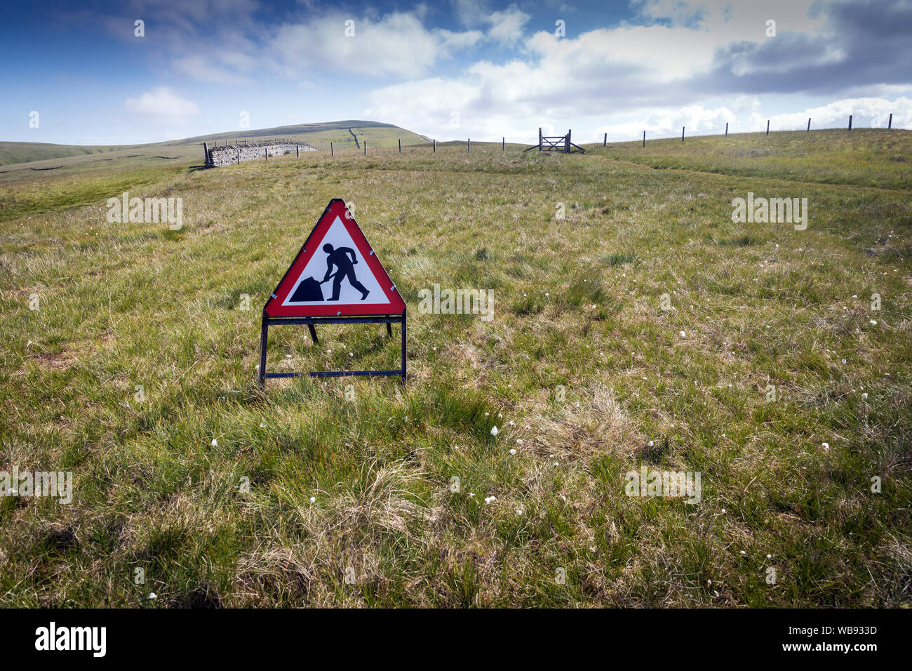 A road works sign incongruously placed on the high fells in the English Lake District, on the route of High Street, the ancient Roman road running fro Stock Photo