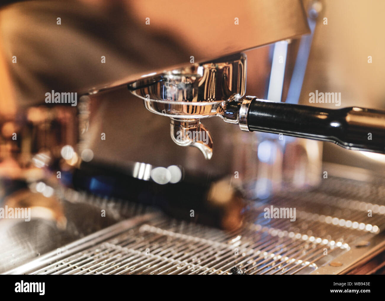 Espresso machine brewing a coffee. Coffee pouring into glasses in