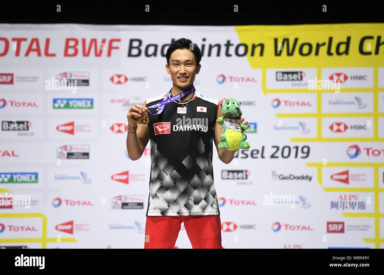 Basel, Switzerland. 25th Aug, 2019. Japan's Momota Kento poses on the  podium during the awarding ceremony for the men's singles at the BWF  Badminton World Championships 2019 in Basel, Switzerland, Aug. 25,