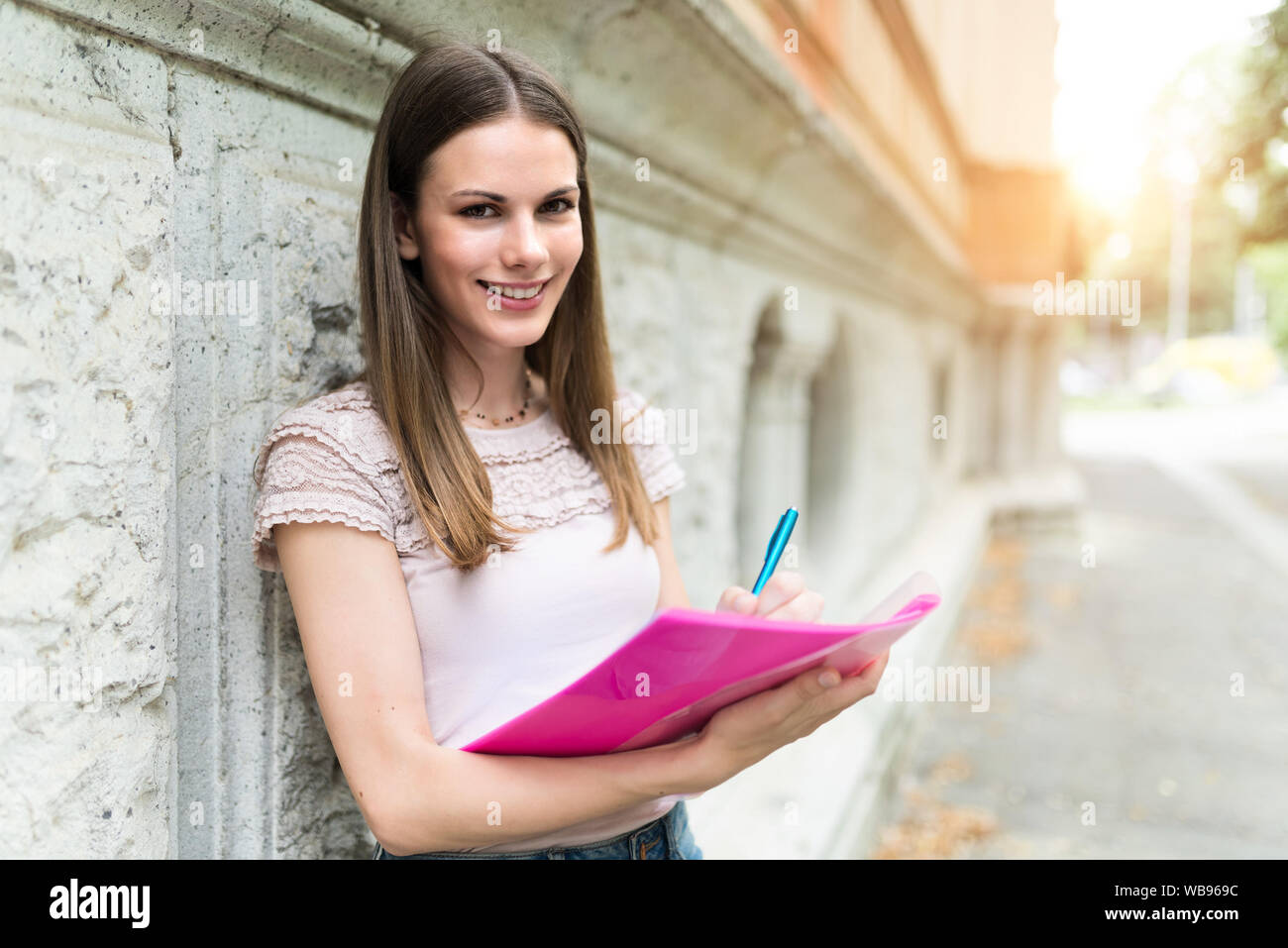 Portrait of a smiling university student Stock Photo - Alamy