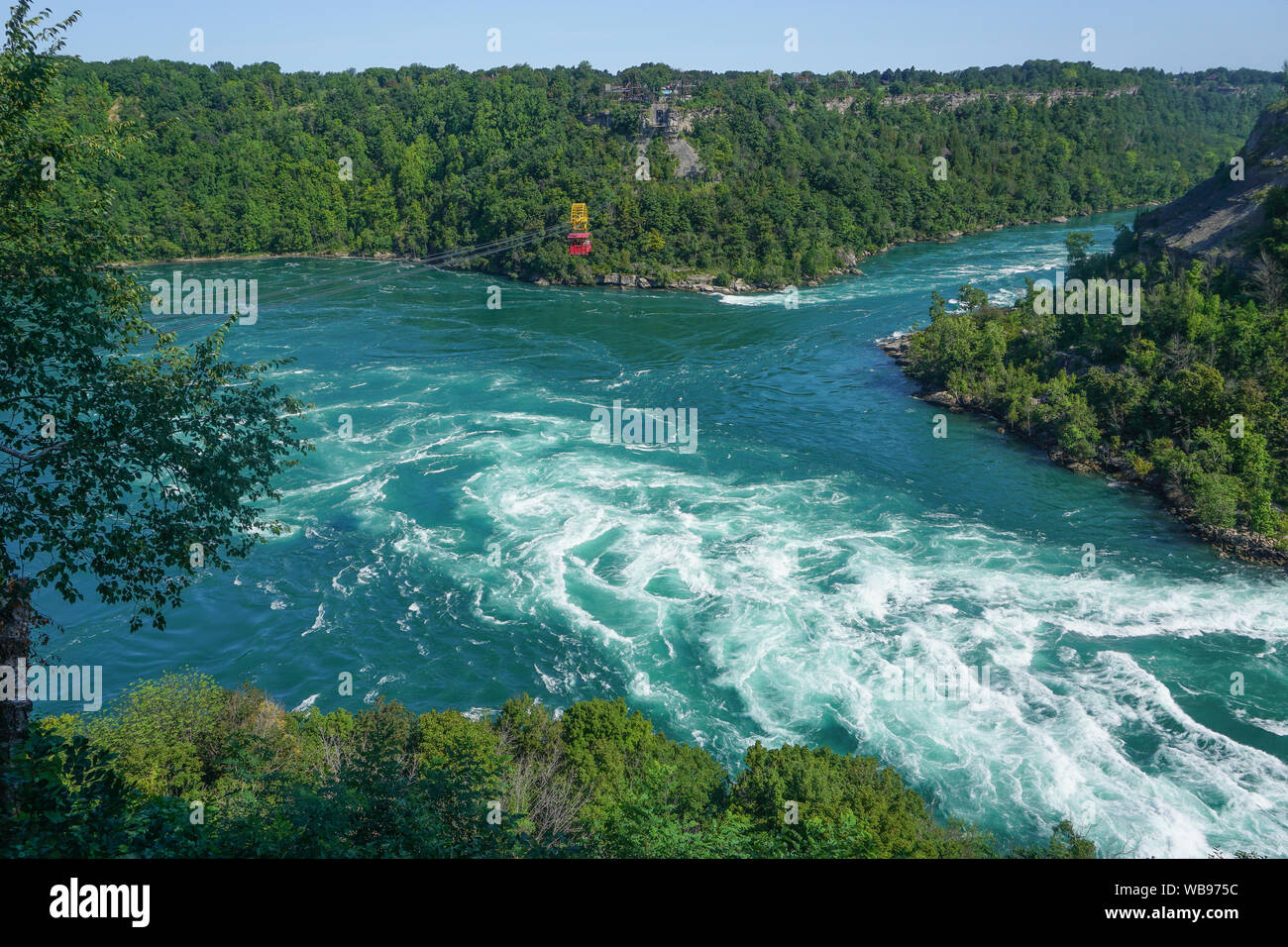 Niagara Falls, Ontario, Canada: An antique cable cars carries visitors across the Niagara River, over the Whirlpool Rapids. Stock Photo