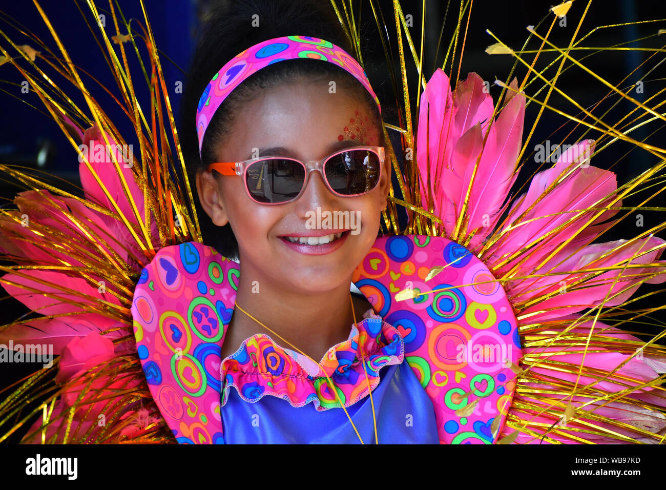 London, UK. 25th Aug, 2019. Thousands attend the first day of the Notting Hill Carnival in west London on August 25, 2019. Nearly one million people are expected by the organizers regradless of the wet weather Sunday and Monday in the streets of west London's Notting Hill to celebrate Caribbean culture at a carnival considered the largest street demonstration in Europe, London, UK. Credit: Picture Capital/Alamy Live News Stock Photo