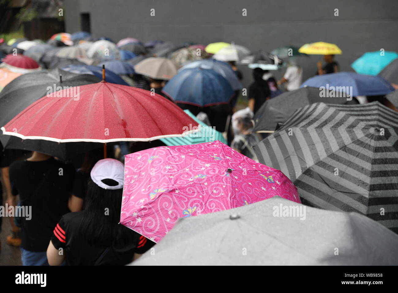 Hong Kong, China. 25th Aug, 2019. 25th August 2019. Hong Kong Anti Extradition Bill protest march in Tsuen Wan and Kwai Tsing. After a peaceful march major clashes took place, with protesters 5th throwing bricks, bottles and molotovs at police lines who were firing constant tear gas, rubber bullets and pepper balls. Police also fired live rounds at one point. Protesters dispersed once police mobilized 2 water cannon vehicles. Credit: David Coulson/Alamy Live News Stock Photo