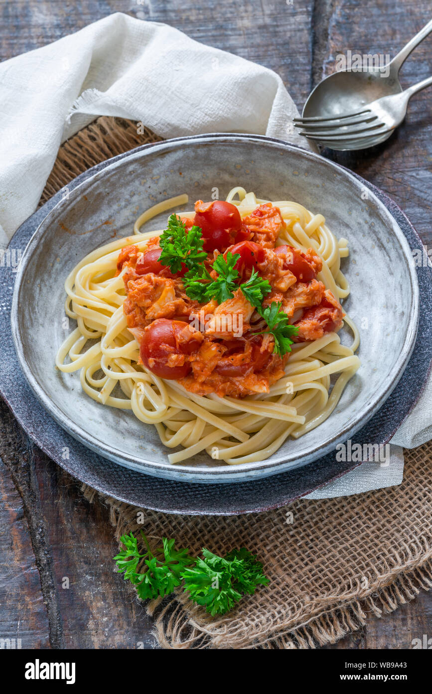Chilli crab and cherry tomato linguine pasta Stock Photo - Alamy